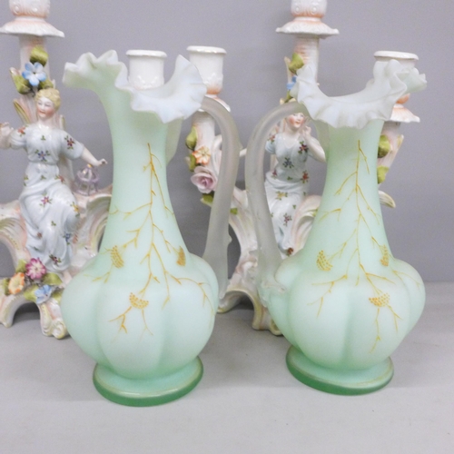 694 - A pair of continental figural candelabra and a pair of glass vases with gilt detail, some petals a/f