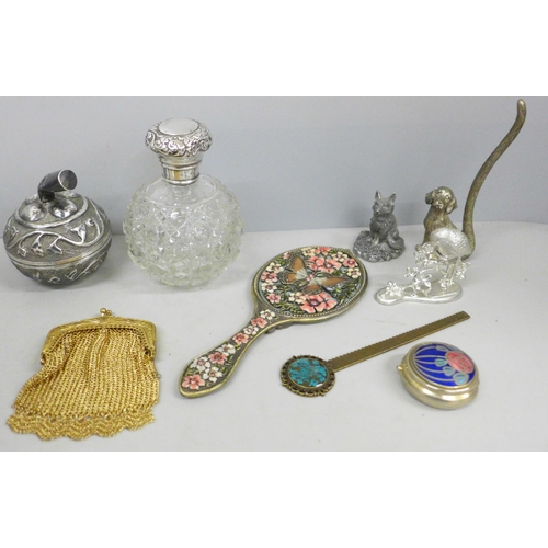 697 - A silver topped glass scent bottle, a 925 silver and enamel pill box, a white metal box in the form ... 