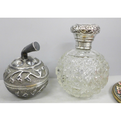 697 - A silver topped glass scent bottle, a 925 silver and enamel pill box, a white metal box in the form ... 