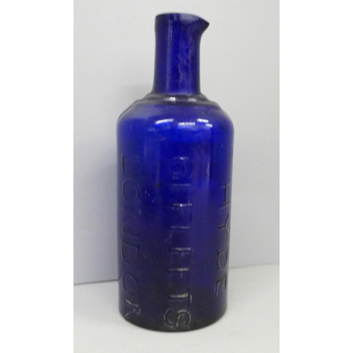 703 - A blue glass ink bottle, marked Hyde 61 Fleets London, 14.5cm