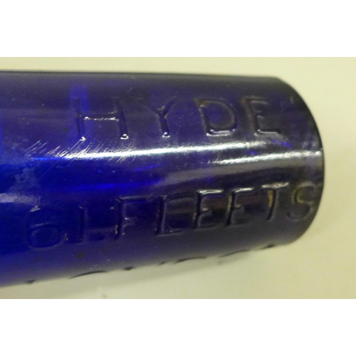 703 - A blue glass ink bottle, marked Hyde 61 Fleets London, 14.5cm