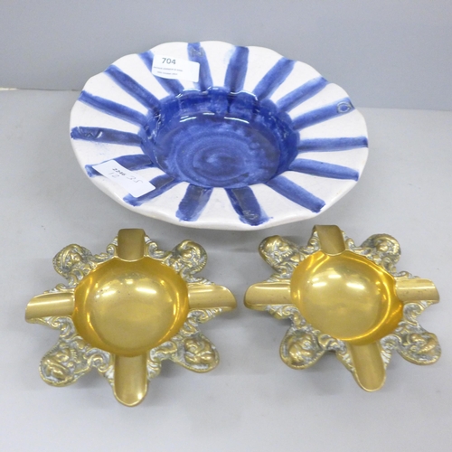 704 - An Erichsen ashtray, 21cm, and two small brass ashtrays