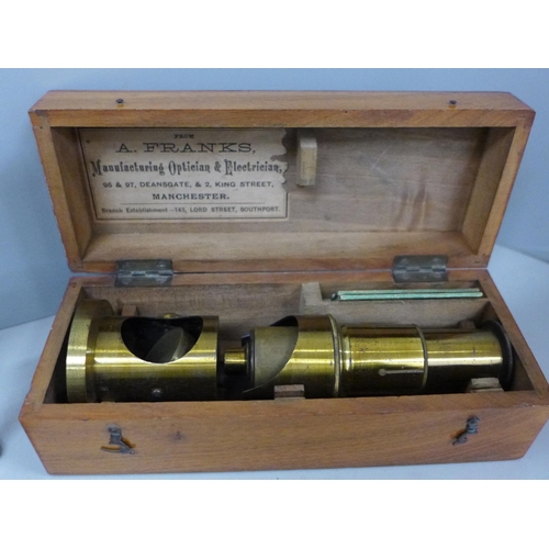 706 - A collection of instruments/tools; a brass microscope, boxed, a leather working tool, two compasses,... 