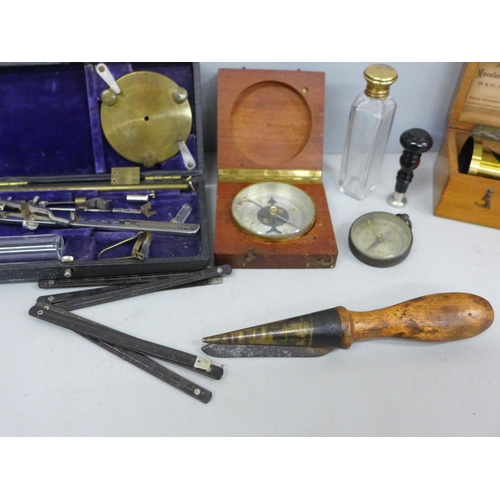 706 - A collection of instruments/tools; a brass microscope, boxed, a leather working tool, two compasses,... 