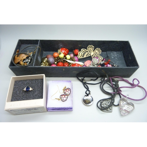 713 - A collection of costume jewellery including earrings, necklaces, a ring, bracelets, etc.