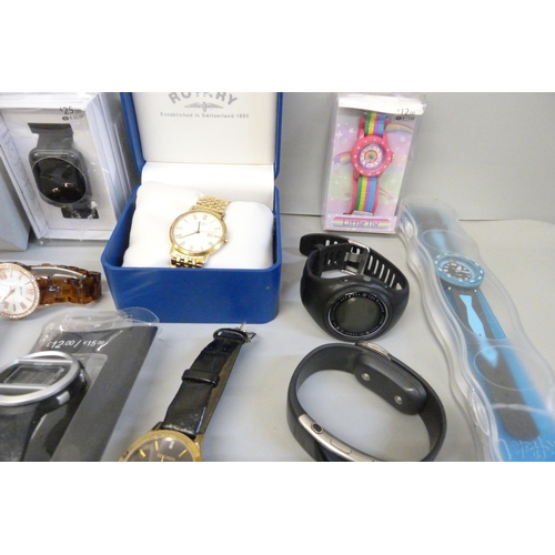 714 - A collection of wristwatches including Sekonda, Rotary, Golf Sky Caddie, Microsoft watch, etc.