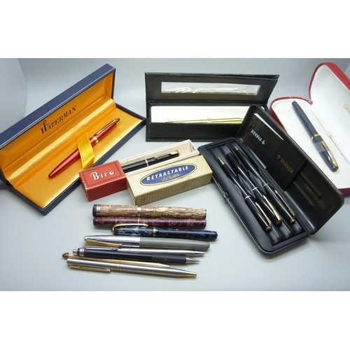 721 - A collection of pens including Waterman, Parker, Sheaffer, etc.