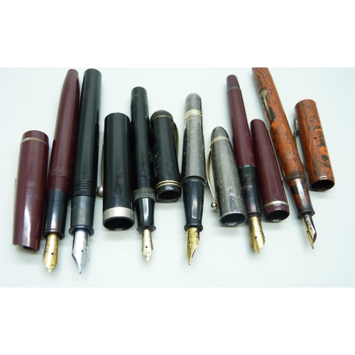 722 - A collection of pens; three with 14ct gold nibs, including Conway Stewart No.479M and The Guinea, an... 