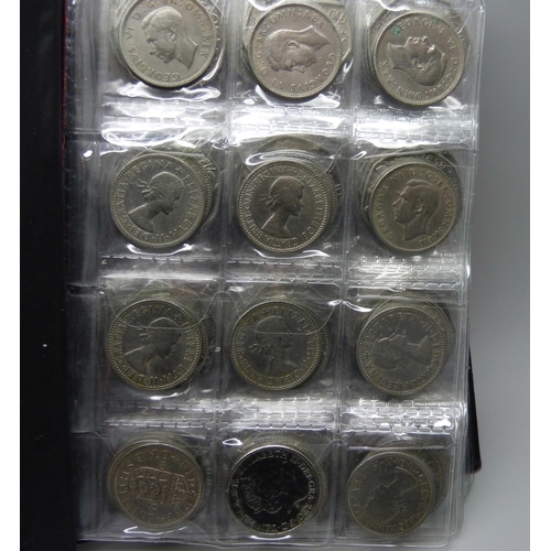 728 - A collection of coins in presentation folder including approximately 90 50p pieces, 20p and 5p