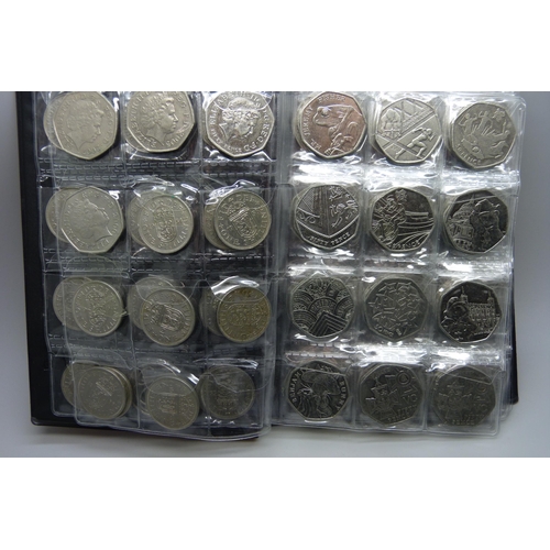 728 - A collection of coins in presentation folder including approximately 90 50p pieces, 20p and 5p