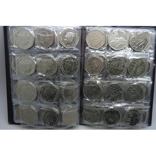 728 - A collection of coins in presentation folder including approximately 90 50p pieces, 20p and 5p