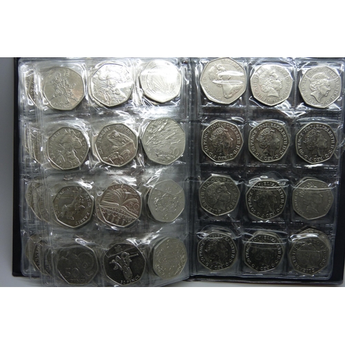 728 - A collection of coins in presentation folder including approximately 90 50p pieces, 20p and 5p