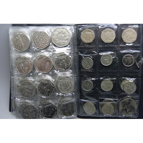 728 - A collection of coins in presentation folder including approximately 90 50p pieces, 20p and 5p