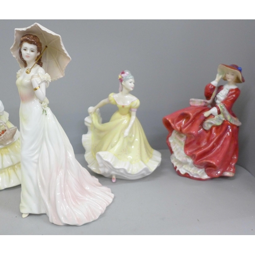 731 - Six figures; Royal Doulton Top O’ The Hill, Royal Worcester Golden Wedding Anniversary and four othe... 