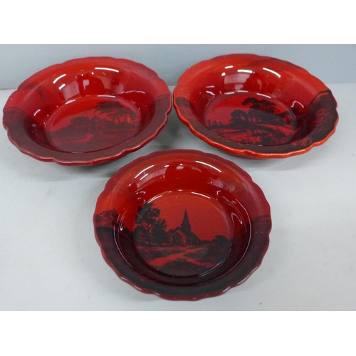 732 - Three Royal Doulton Flambe dishes with rural scenes, signed by Charles Noke, (large dishes 15.5cm, b... 