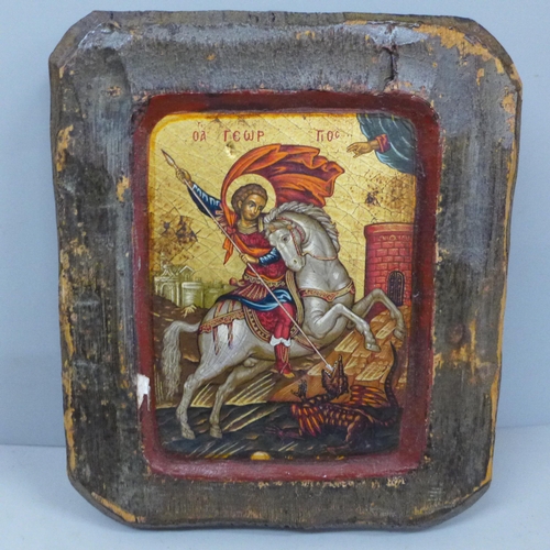 738 - A carved and hand painted Greek icon, St George slaying the dragon, 14.5cm wide