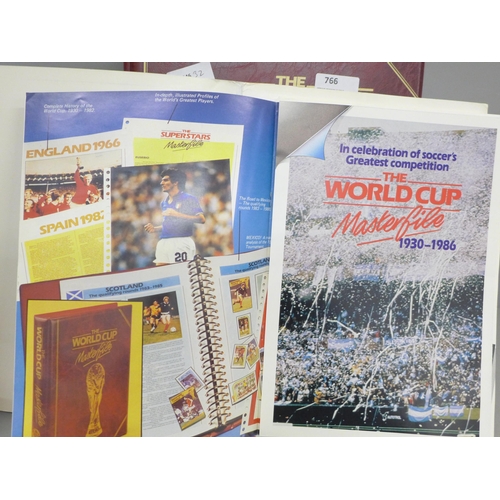 766 - Football; an album of World Cup first day covers together with a 1986 souvenir portfolio