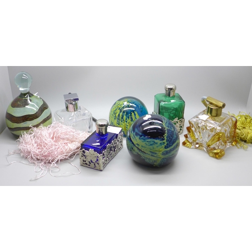 768 - Three paperweights and four scent bottles