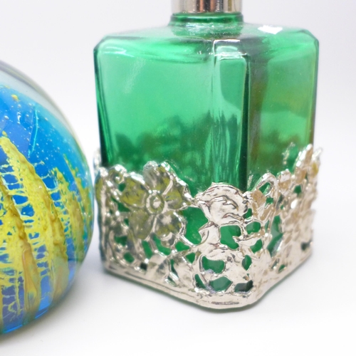 768 - Three paperweights and four scent bottles