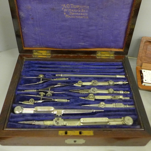 788 - A collection of drawing instruments and rulers including a boxed set