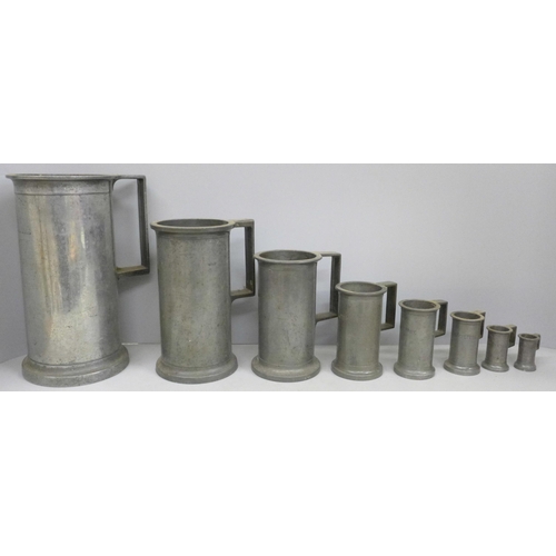 797 - A set of eight pewter tankard measures, largest ‘double litre’ and 23.5cm