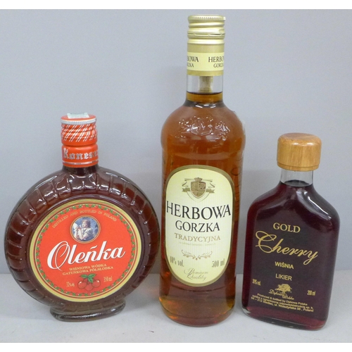 809 - Three bottles; Polish Gold cherry vodka, Olenka cherry vodka and Herbowa Gorzka orange and caramel v... 