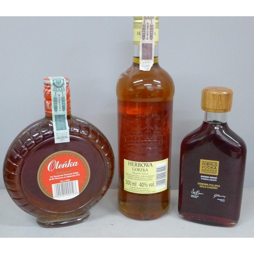 809 - Three bottles; Polish Gold cherry vodka, Olenka cherry vodka and Herbowa Gorzka orange and caramel v... 