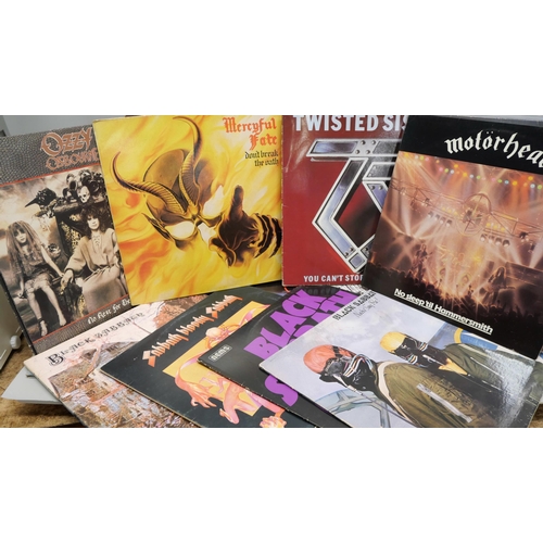 813 - Sixteen LP records including metal and rock