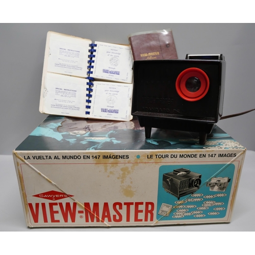 820 - Two View-master 3D viewers, a Sawyers View-master, boxed, and a collection of View-master slides