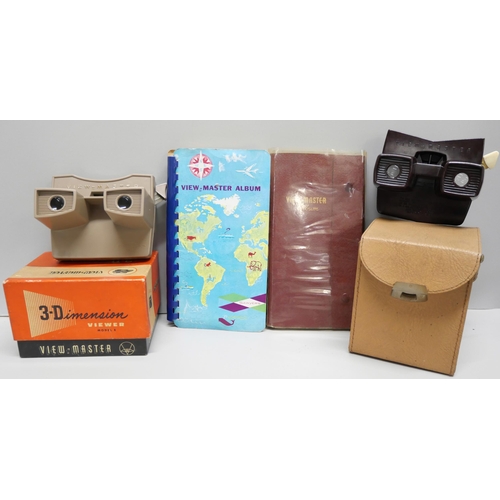 820 - Two View-master 3D viewers, a Sawyers View-master, boxed, and a collection of View-master slides