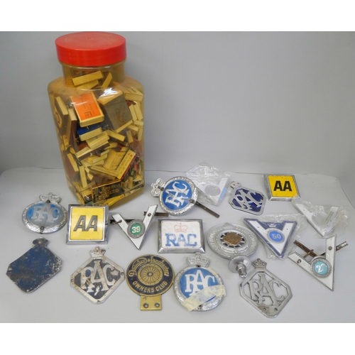 858 - A collection of car badges including AA, RAC and GEM and a jar of matchboxes from around the world