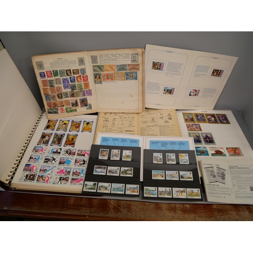 886 - A collection of stamps including three albums, loose stamps, an empty album, etc.