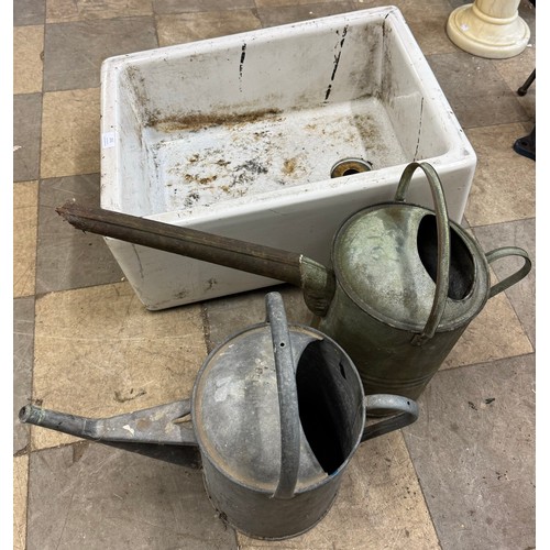 251 - A Belfast sink and two galvanised watering cans