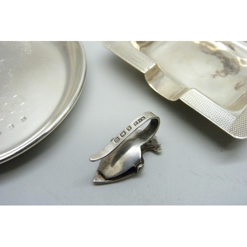 947 - A silver napkin holder, Birmingham 1911, a silver dish and a silver ash tray, 70g total