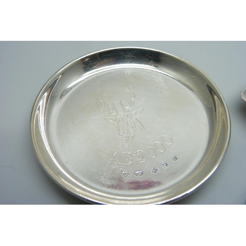 947 - A silver napkin holder, Birmingham 1911, a silver dish and a silver ash tray, 70g total