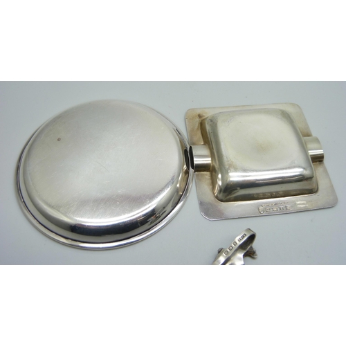 947 - A silver napkin holder, Birmingham 1911, a silver dish and a silver ash tray, 70g total