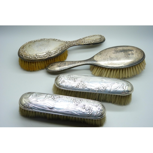 953 - Three silver backed brushes