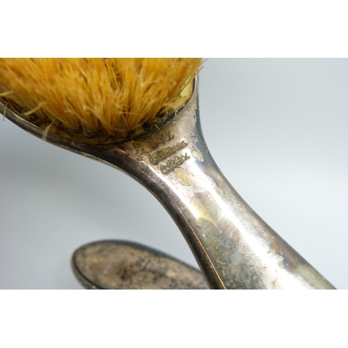 953 - Three silver backed brushes