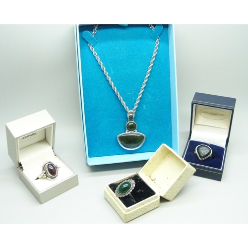 956 - A large silver stone set pendant and chain, 19g, and three white metal rings