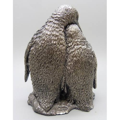 962 - A Country Artists hallmarked silver covered penguin group, 9.5cm, boxed