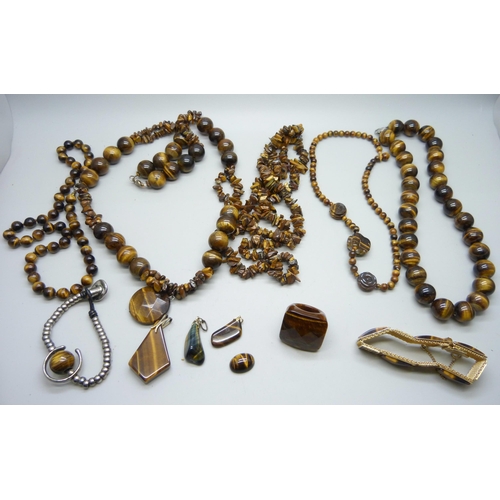 965 - A collection of tiger's eye jewellery including pendants, necklaces and bracelets