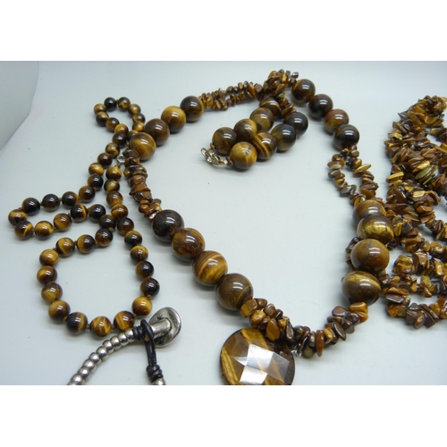 965 - A collection of tiger's eye jewellery including pendants, necklaces and bracelets