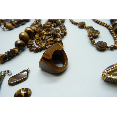 965 - A collection of tiger's eye jewellery including pendants, necklaces and bracelets