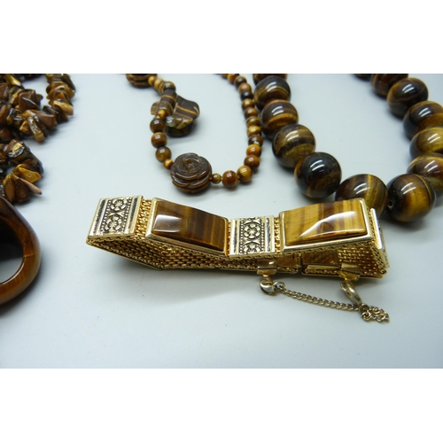 965 - A collection of tiger's eye jewellery including pendants, necklaces and bracelets