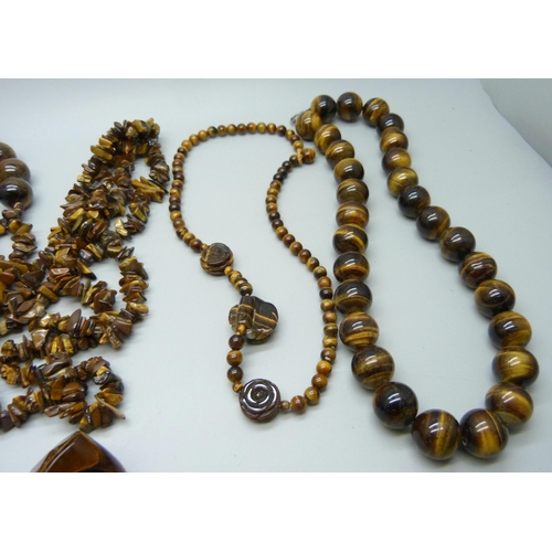 965 - A collection of tiger's eye jewellery including pendants, necklaces and bracelets