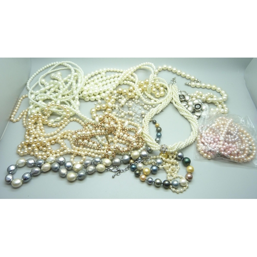 970 - A collection of faux pearls and a collection of real pearls