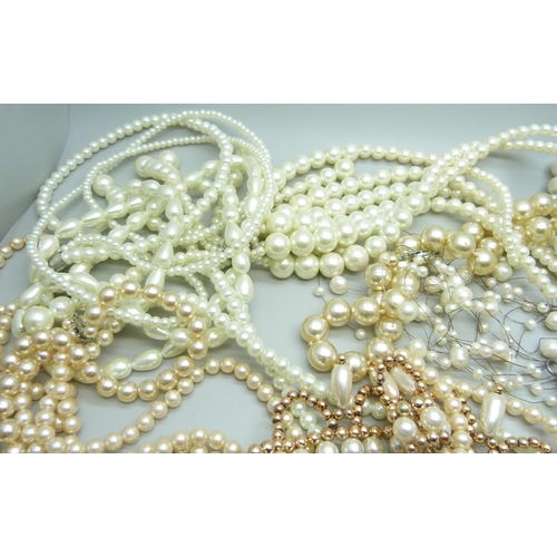 970 - A collection of faux pearls and a collection of real pearls