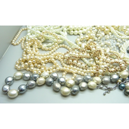 970 - A collection of faux pearls and a collection of real pearls