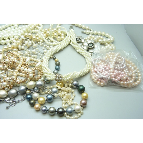 970 - A collection of faux pearls and a collection of real pearls