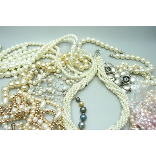 970 - A collection of faux pearls and a collection of real pearls